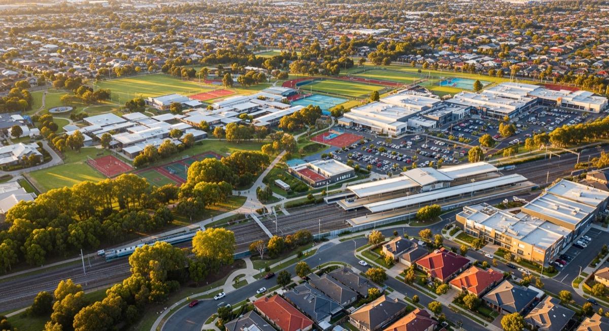 Aerial view of an Australian suburb showing parks, schools, shopping centres, and transport links that contribute to a suburb's lifestyle score
