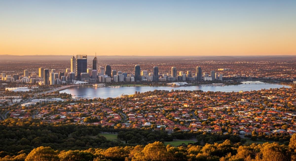 Perth city skyline and suburban sprawl at golden hour showing the property market landscape discussed in this analysis